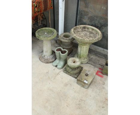 AN ASSORTMENT OF RECONSTITUTED STONE GARDEN ITEMS TO INCLUDE TWO BIRD BATHS, A PLANTER AND A PEDESTAL BASE ETC
