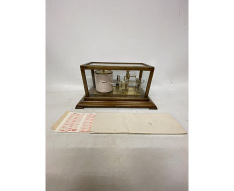 A VINTAGE OAK CASED BAROGRAPH WITH SPARE CHARTS 