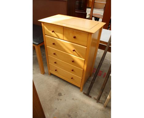A LIGHT WOOD CHEST OF TWO SHORT AND FOUR LONG DRAWERS, 33" WIDE