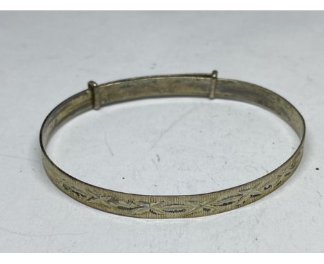 A MARKED STERLING SILVER ADJUSTABLE BANGLE 