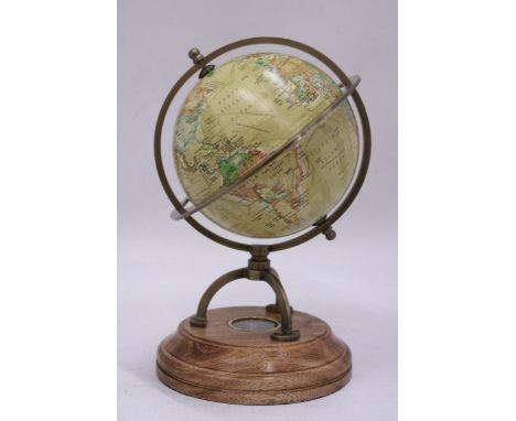 A WORLD GLOBE WITH A COMPASS ON A WOODEN BASE, HEIGHT APPROX 23CM