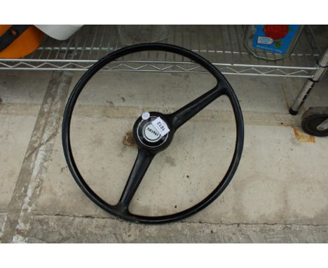 A VINTAGE MINI CAR STEERING WHEEL 