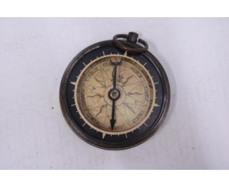 A BRASS COMPASS 
