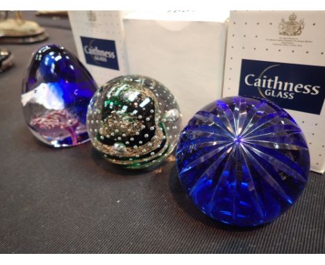Three boxed Caithness paperweights  CONDITION REPORT: Helen McDonald Milleun Story Caithness is the name of the dark blue pap