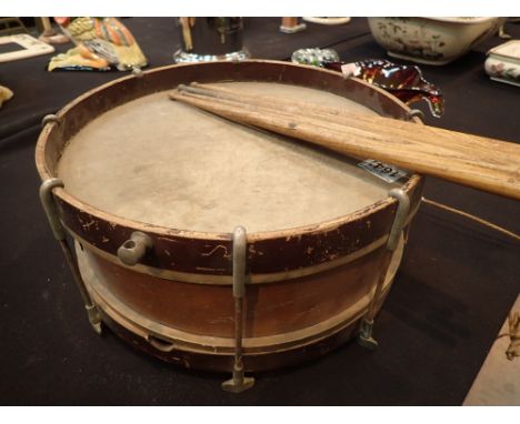 Vintage snare drum and some drumsticks 