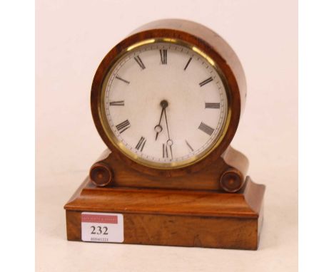 A late 19th century continental walnut cased drum shaped mantel clock, having a circular enamel dial with Roman numerals and 