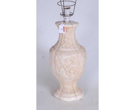 A 20th century Chinese style resin table lamp, of baluster form, carved with Cantonese style decoration, h.56cm (including fi