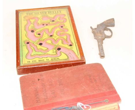 A vintage Rippit toy pistol, together with a Manual of Protection Against Gas &amp; Air Raids, and a silver bullet table top 