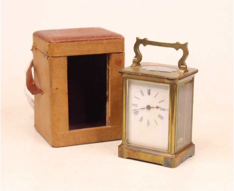 An early 20th century lacquered brass cased carriage clock, having enamelled dial with Roman numerals, visible platform lever