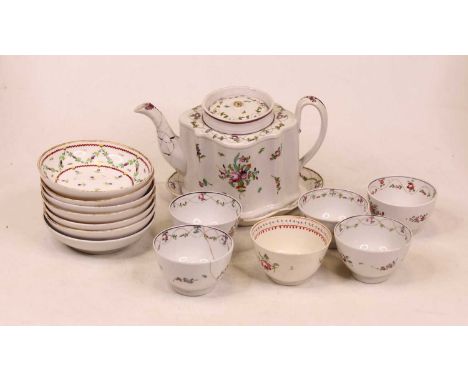 A late 18th century porcelain teapot and cover, of shaped oval form, enamel decorated with flowers, on matching stand; togeth