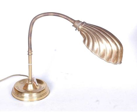 A 1930s brass adjustable desk lamp in the form of a clam shell, approx h.33cm