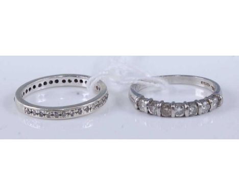 A platinum and diamond half hoop ring, arranged as 7 brilliants, total diamond weight est approx 0.56ct, 4.3g, size O/P, toge