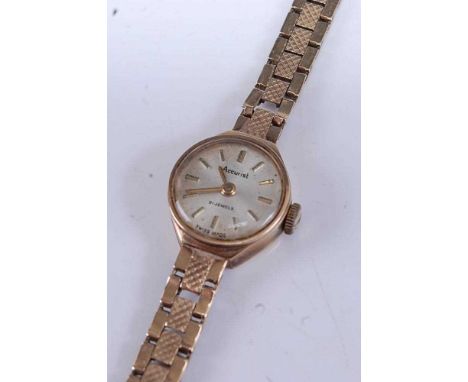 An Accurist ladies 9ct gold cased bracelet watch having signed silver dial and manual wind movement, case dia. 15mm, gross we