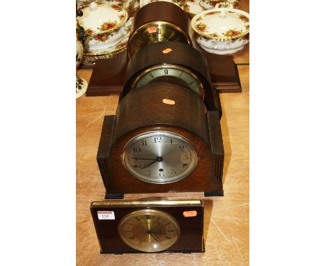 A 1950s oak cased mantel clock having a silvered dial with Arabic numerals and chiming movement, height 23cm, together with o