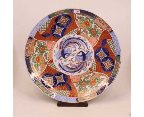 A large Japanese Meiji period (1868-1912) charger of circular form, the centre enamel decorated with two birds of paradise wi