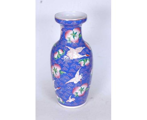 A 20th century Chinese enamel painted vase, decorated with plums and cranes, h.45cm