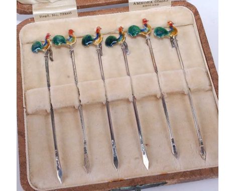 A cased set of six art deco silver and enamel cocktail sticks, each surmounted with a cockerel, case width 10.5cm