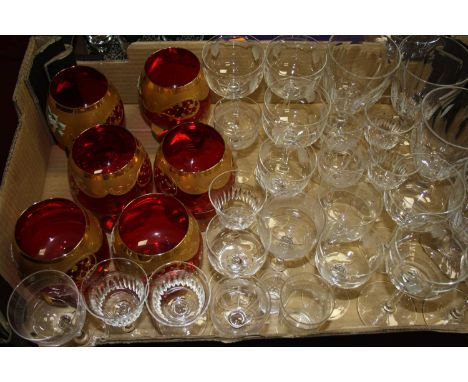 Two boxes of mixed glassware, to include acid etched examples, set of six ruby glass oversize brandy balloons etc 