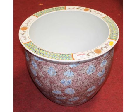 A large modern Chinese stoneware jardiniere, enamel decorated on a purple ground with blue flowers, h.32cmCondition report: C