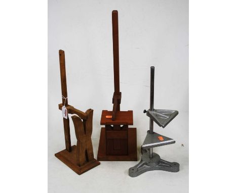 A mid-20th century adjustable table-top clamp; together with two wooden horologists tools(?) (3)