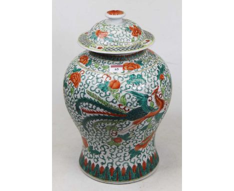 A large Chinese export stoneware vase and cover, of baluster form, enamel decorated with a bird of paradise within flowers an