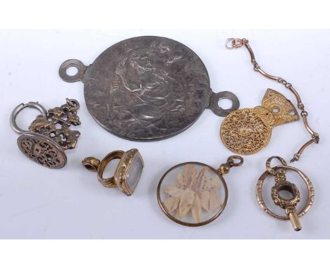 Mixed lot to include white metal medallion with later fixings, two fob pendants, watch key and balance cock etc