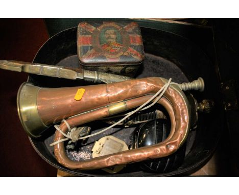 An early 20th century military hat box, bearing label for Steve Matthews &amp; Seagrove, containing a copper bugle, Eastern j