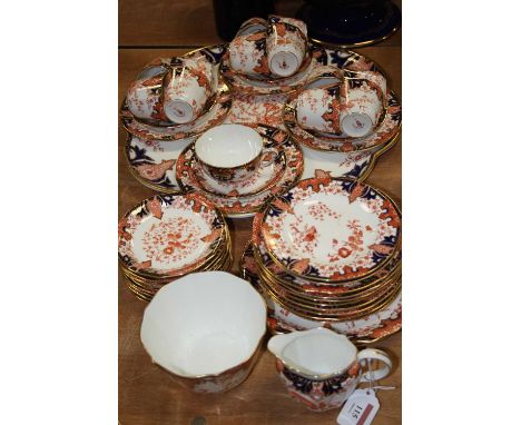 A Royal Crown Derby 12-place setting part tea service, decorated in the Imari palette, pattern No.2712, having printed mark v