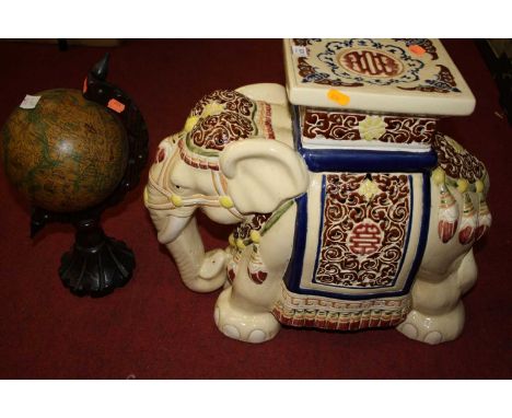 A large ceramic Indian elephant; and a reproduction wooden globe on wooden base (2)