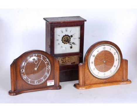 A mid 20th century Smiths oak cased mantel clock, h.18cm; together with two other examples (3)