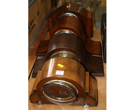 A 1930s walnut cased mantel clock having a silvered chapter ring with Roman numerals and chiming movement, width 33cm, togeth