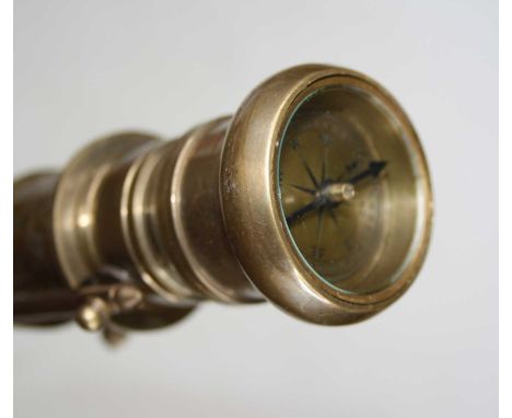 A military style walking stick, the brass mount inset with a compass, length 94cm