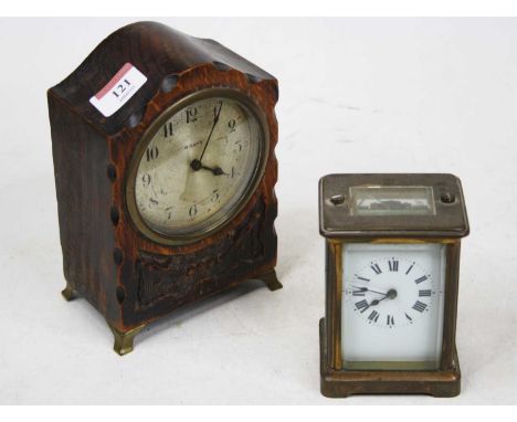 An early 20th century French lacquered brass cased carriage clock, having an enamelled dial with Roman numerals and visible p