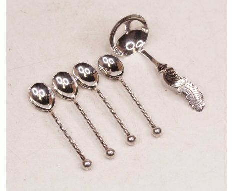 A set of four 20th century continental white metal coffee spoons, each having a spirally turned stem and ball finial; togethe