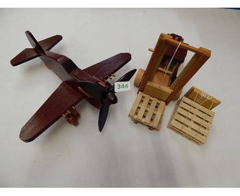 WOODEN MODELS WELL MADE OF CURTIS P40 KITTYHAWK IN PADAUK, EBONY & BEECH, PLUS MODEL OF FORK LIFT TRUCK WITH PALLETS & SPARE 