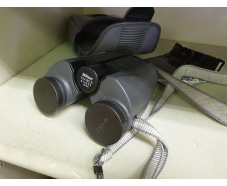 A pair of Nikon 10x25 compact binoculars       OS2