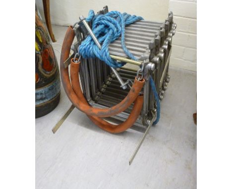 A cast metal, concertina action, folding fire escape ladder       BSR