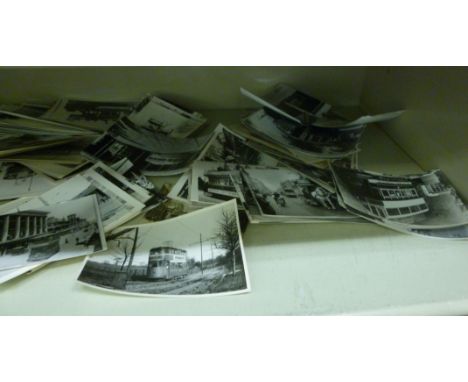 An uncollated collection of monochrome, postcard size photographs, taken during the first half of the 20thC, featuring an ecl