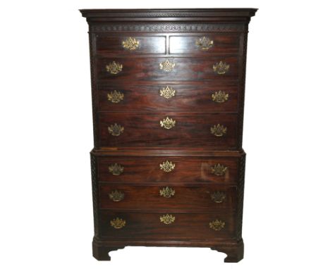 A George III mahogany chest on chest the dentil over-hanging cornice above a fretwork band with two short above three graduat