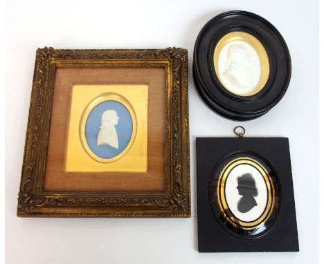 A framed Wedgwood blue jasper plaque depicting a portrait of John Wesley 26cm x 24cm, together with a Tassie style plaster pl