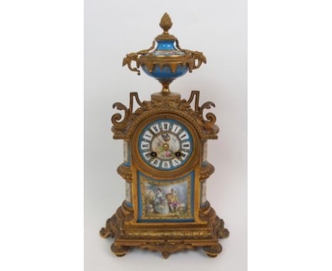 A late 19th century French Sevres style ormolu and porcelain mounted clock the porcelain dial with roman numerals and painted