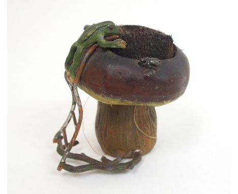 A novelty cast spelter figural nib brush modelled as a toadstool with bristles inset to centre with a frog climbing ladder up