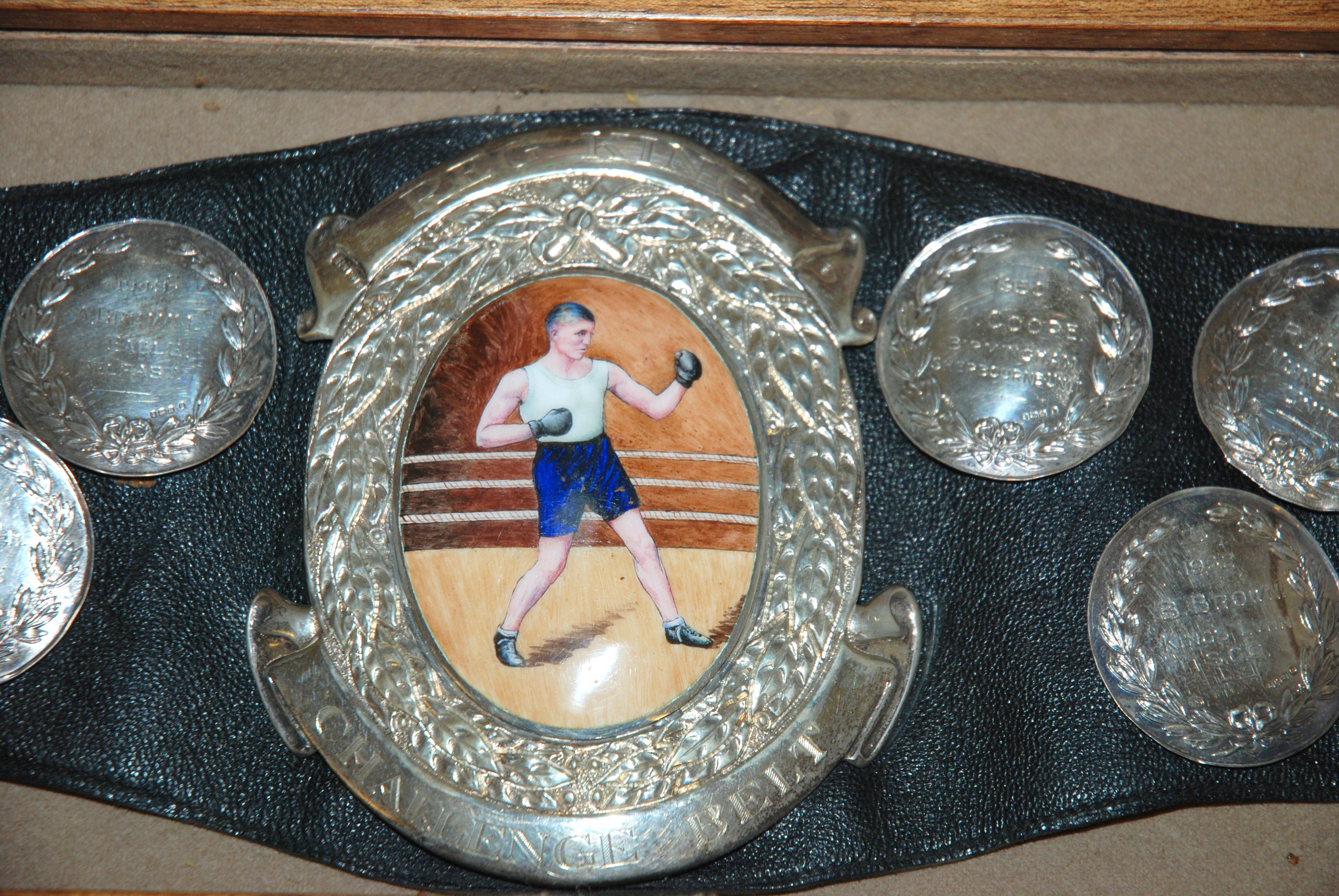 A silver and enamel Reg King Challenge Belt the leather belt bearing