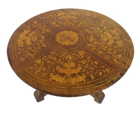 A Dutch marquetry circular occasional table the top decorated with panels of flowers issuing from vases surrounding central f