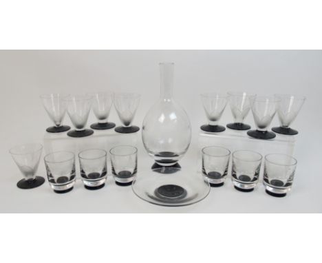 A Simon Gate for Orrefors Art Deco decanter and glasses set the clear glass bottle shaped body with black glass base, with si