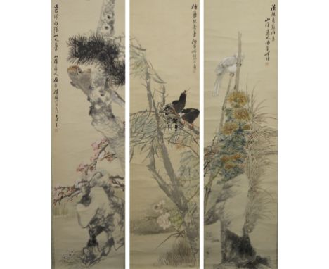 A Chinese scroll painting of a parrot on a blossoming branch, 184 x 49cm and another two similar, each with script and seal m