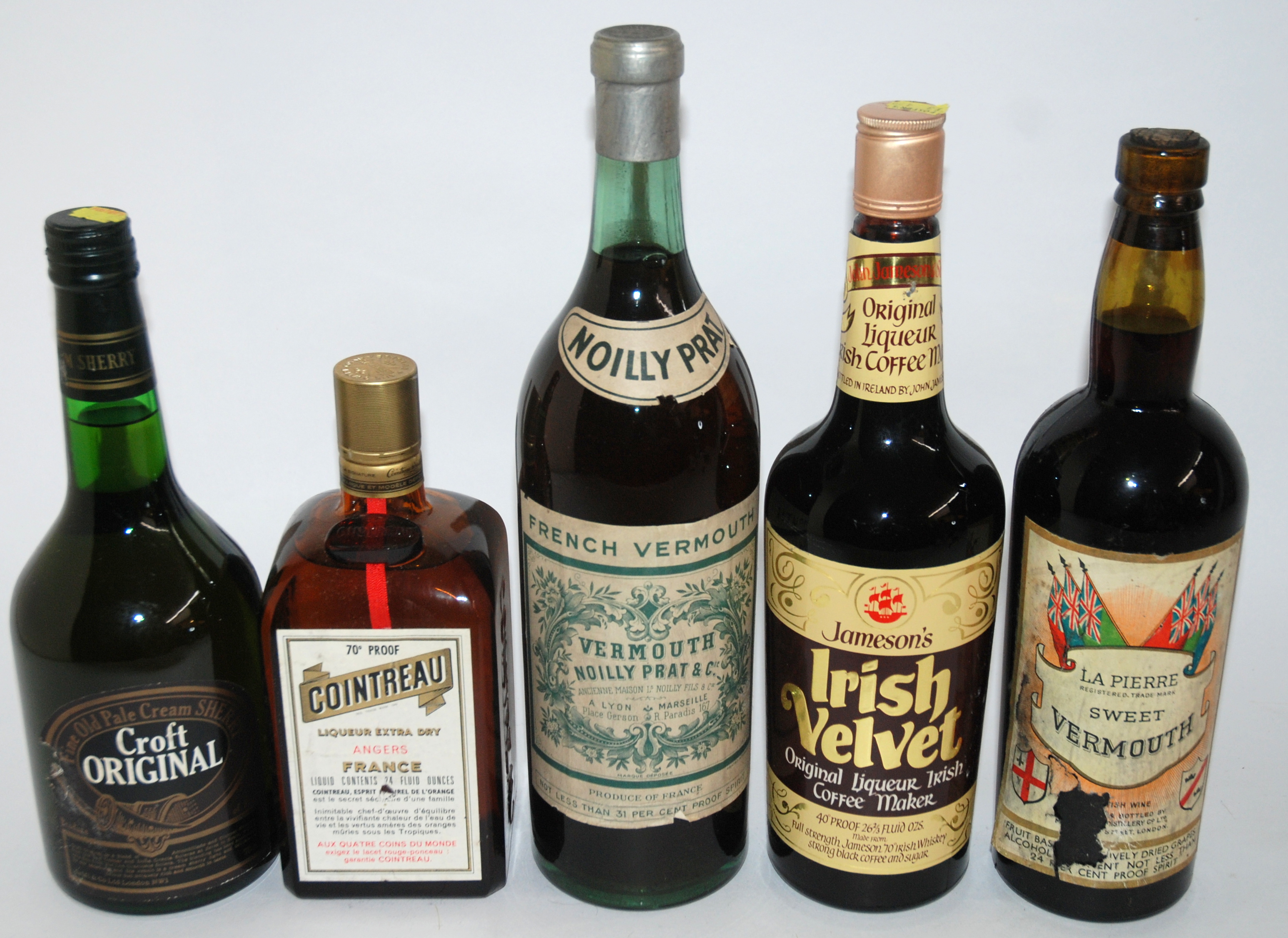 A collection of various alcohol including La Pierre Sweet Vermouth ...