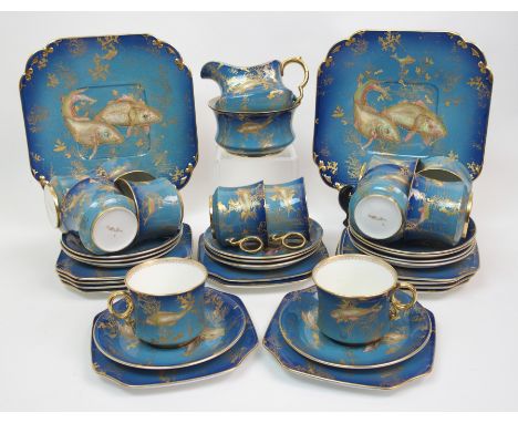 A Carlton China Carp pattern tea service the aqua blue ground decorated with carp in gilt and coloured enamels, comprising tw