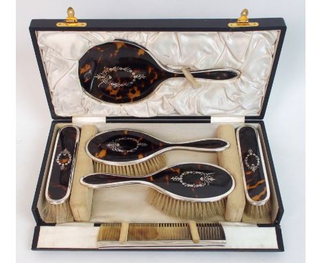 A six piece silver and tortoiseshell dressing table set by E S Barnsley & Co, (Edward Souter Barnsley), Birmingham 1921, comp