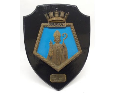 The original gangway plaque from the HMS Glasgow decorated with a figure of St. Kentigon, with brass plaque inscribed 'Presen